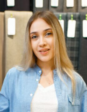 woman-measures-the-fabric-in-textile-store-2021-08-30-02-34-47-utc.jpg